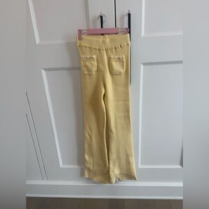 Frankie’s Bikinis sweater pants, pockets in front and detailed scalloped ankle